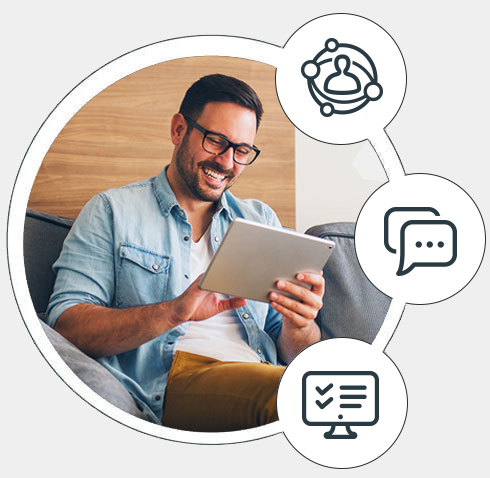 Man sitting on a couch using a tablet