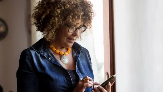 A woman looking at her phone