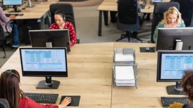Employees at their workstations