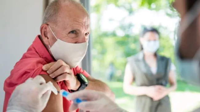 A senior citizen getting vaccinated
