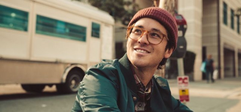 A guy on the street smiling