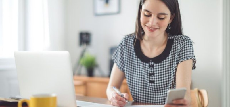 Woman smiling while working
