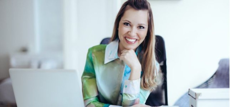 A happy woman in her office