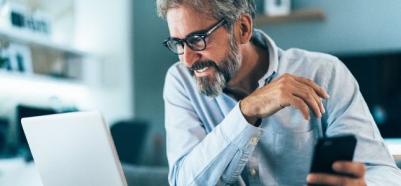 A man looking at his monitor